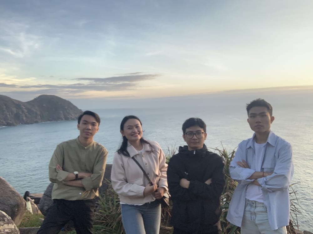 Four of us at a coastal lookout at sunset