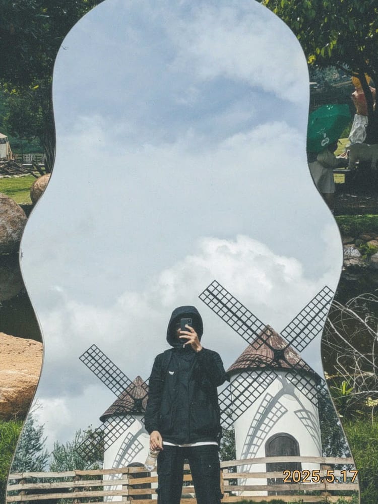 Mirror selfie in front of a windmill garden